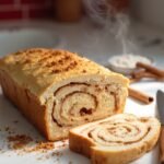 "Keto cinnamon swirl bread with almond flour and erythritol on a clean marble countertop"